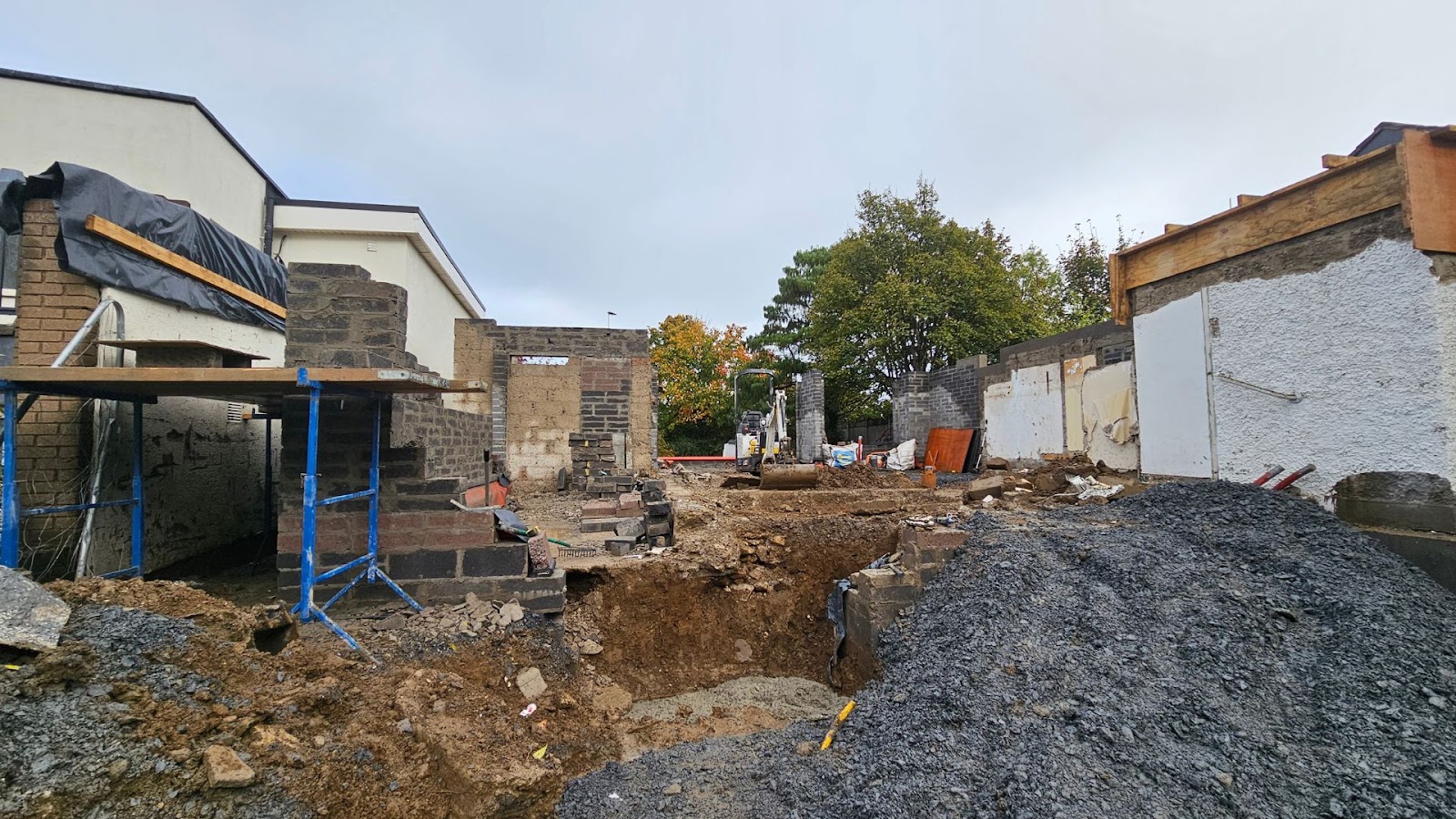 Construction site is being built in front of a house