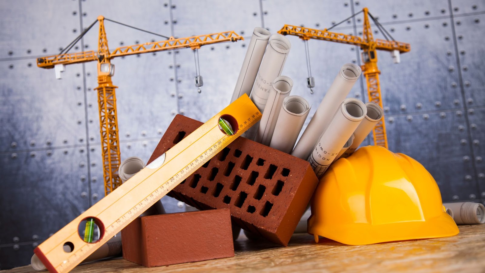 Construction materials and a hard hat on a table