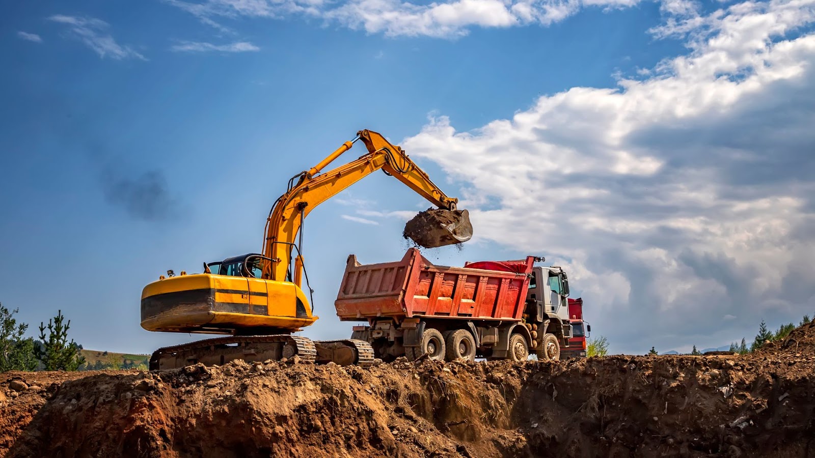 Dump truck and excavator are working on a construction site