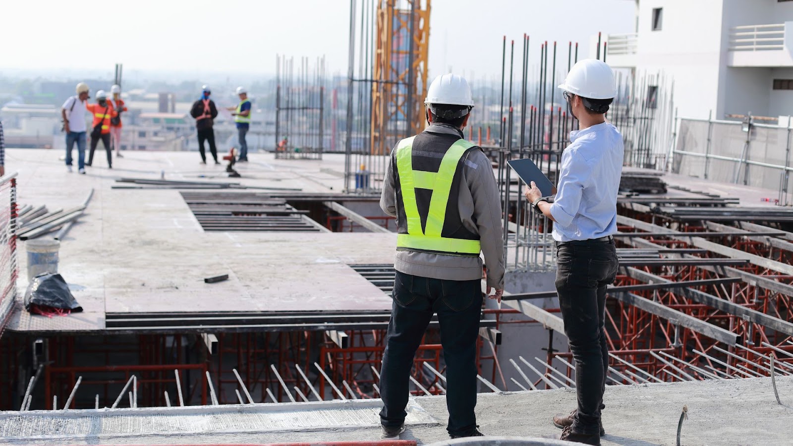 Group of construction workers standing on a construction site